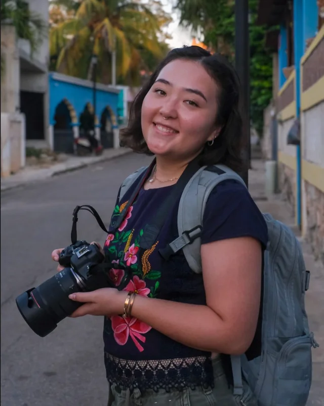 Ayako smiling with her camera